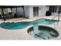 Refreshing backyard pool and hot tub area, perfect for relaxation and entertaining near the house at 800 Sand Crane Ln, Lake Helen, FL 32744