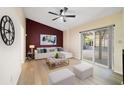 Cozy living room with a vaulted ceiling, stylish decor, and a sliding glass door at 10562 Bridlewood Ave, Orlando, FL 32825