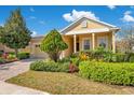 Lovely single-story home with lush front yard landscaping, a brick driveway, and inviting curb appeal at 117 Cupania Ct, Groveland, FL 34736