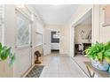 Inviting tiled foyer with natural light, leading to an open floor plan with plant accents at 1531 Norfolk Ave, Winter Park, FL 32789