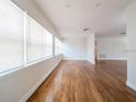 Bright living room featuring hardwood floors and large windows at 5513 Riordan Way, Orlando, FL 32808