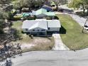 An aerial view captures this single Gathering home, showcasing the property and surrounding neighborhood streets at 820 Dove Ridge Dr, Lakeland, FL 33803