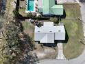 Overhead view highlights the single Gathering home's roof, driveway, and a neighbor's pool in the backyard at 820 Dove Ridge Dr, Lakeland, FL 33803