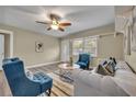 Comfortable living room with stylish furniture, modern ceiling fan and wood-look floors at 1416 E 20Th St, Sanford, FL 32771