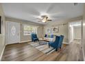 Open-concept living room with wood-look floors and bright natural light at 1416 E 20Th St, Sanford, FL 32771