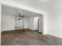 Spacious living room with neutral carpet and open layout at 1622 Dolphin Dr, St Cloud, FL 34771