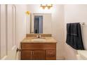 Bathroom with a granite countertop, wood vanity, and a neutral color scheme at 4004 Barwood Dr # 3804, Orlando, FL 32839