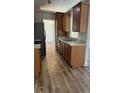 Functional kitchen features wood cabinets and black appliances at 7314 Seena Ct, Orlando, FL 32835