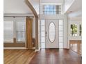 Inviting entryway with tile flooring, complemented by natural light and an elegant chandelier fixture at 965 Rosinia Ct, Orlando, FL 32828