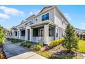 Charming townhome exterior with well-maintained landscaping and inviting front porches at 1194 Spotted Sandpiper Loop, Winter Springs, FL 32708