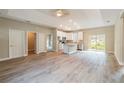 Inviting open floor plan seamlessly connects the living area to the kitchen, perfect for entertaining guests at 1385 5Th St, Orange City, FL 32763