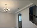 View of the dining area with chandelier and staircase at 17792 Adrift Rd, Winter Garden, FL 34787