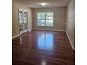 A spacious living room features hardwood floors, neutral walls, and natural light at 2019 Dixie Belle Dr # 2019O, Orlando, FL 32812