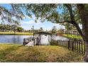 Scenic backyard waterfront with private dock and boat lift, perfect for relaxing lakeside living at 2431 Westwood Dr, Longwood, FL 32779