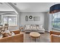 Bright living room featuring tile flooring, neutral decor, and dining nook in background at 2801 Lido Key Ct, Kissimmee, FL 34747