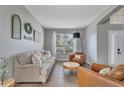 Cozy living room with modern decor, tile floors, and large windows at 2801 Lido Key Ct, Kissimmee, FL 34747