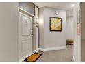 Hallway view features a welcome mat, unit number 4206, and stylish artwork at 7517 Laureate Blvd # 4206, Orlando, FL 32827