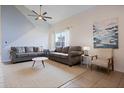 This stylish living room features plush sofas, neutral decor, and bright natural lighting at 7902 Silver Bass Ct, Kissimmee, FL 34747