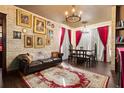 Stately living room with brick walls, dark floors, dramatic decor and adjoining dining area at 8929 Legacy Ct # 106, Kissimmee, FL 34747