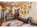 Cozy living room with dark wood floors, stone walls, and decor at 8929 Legacy Ct # 106, Kissimmee, FL 34747