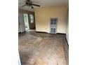 View of a living room showcasing its size and natural light through windows at 1805 Riley Ave, Orlando, FL 32805