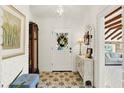 Bright entryway with white brick walls, decorative tile flooring, and charming accents at 234 N Lakeview Ave, Winter Garden, FL 34787