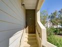 Inviting front door with a secure entrance and short staircase at 2956 S S Semoran Blvd # 1407, Orlando, FL 32822