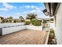 Lovely outdoor patio with elegant wood-look tiles, perfect for relaxing or entertaining guests at 662 Sausalito Blvd, Casselberry, FL 32707