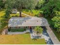 Attractive aerial view of the property showcasing the home's layout, landscaped yard, and convenient carport at 217 Wilmer Ave, Orlando, FL 32811