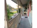 Inviting covered front porch with classic columns, offering a relaxing outdoor space and neighborhood views at 217 Wilmer Ave, Orlando, FL 32811