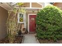 Eye-level capture of the front door with a decorative wreath and a 'Welcome Home' sign at 3623 S Saint Lucie Dr, Casselberry, FL 32707