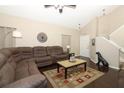 Spacious living room boasts a plush sectional sofa, hardwood floors, and a high vaulted ceiling at 3623 S Saint Lucie Dr, Casselberry, FL 32707