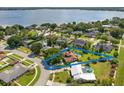 Aerial view showcases this beautiful neighborhood, with pool and lake access at 5220 Jade Cir, Orlando, FL 32812