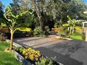 Landscaped backyard featuring gravel beds, plants, and raised flower beds at 548 Big Sioux Ct, Kissimmee, FL 34759
