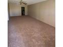 A large living room featuring neutral carpeting, providing a versatile living space at 725 Northlake Blvd # 66, Altamonte Springs, FL 32701