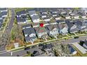 Aerial view of a home in a neighborhood featuring manicured lawns and is situated near a picturesque pond at 1073 Sadler Oaks Way, Winter Garden, FL 34787