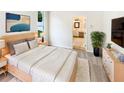 A spacious main bedroom featuring plush carpeting and an en-suite bathroom at 1168 Ballyshannon Pkwy, Orlando, FL 32828