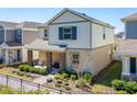 Beautiful two-story home with well-maintained landscaping and a welcoming front porch area at 2977 Howley Aly, St Cloud, FL 34771