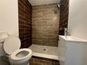 Contemporary bathroom featuring tiled walls, a stylish vanity, and modern fixtures at 4005 Clarcona Ocoee Rd, Orlando, FL 32810