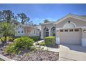 Beautiful single-story home with a well-manicured front yard, two-car garage and traditional architectural design at 4532 Saddleworth Cir, Orlando, FL 32826