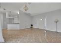 Spacious living room featuring neutral walls and ceramic tile flooring at 609 Bluebill Ln, Kissimmee, FL 34759