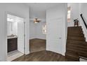 Hallway view reveals a bathroom, bedroom, and stairs, showcasing the home's layout and modern design at 1012 Parma Cir, Lake Mary, FL 32746