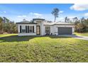 Charming single-Gathering home boasts a well-manicured lawn and attached two car garage at 15163 Sw 29Th Terrace Rd, Ocala, FL 34473