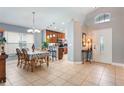 Inviting foyer and dining room features tile flooring, neutral paint and abundant natural light at 3733 Pyrite Dr, Orlando, FL 32826