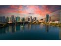 Breathtaking aerial view of the city skyline reflected in a serene lake, capturing the essence of urban tranquility at 401 E Robinson St # 101, Orlando, FL 32801