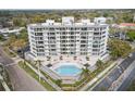 Beautiful exterior showcases the building, pool, and lush landscaping of the property at 401 E Robinson St # 101, Orlando, FL 32801