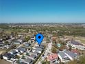 Beautiful aerial view of the neighborhood, showcasing homes and surrounding green spaces at 7464 Gathering Dr, Reunion, FL 34747