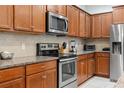 Well-equipped kitchen with granite countertops, stainless steel appliances, and ample cabinet space at 8879 Geneve Ct, Kissimmee, FL 34747