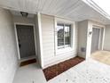 Welcoming front entrance with a stylish gray door and modern accents at 142 Long Leaf Pine Cir, Sanford, FL 32773