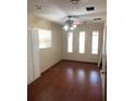 A bedroom with a ceiling fan and wood floors with natural light coming through the window at 4206 Clarinda St, Orlando, FL 32811